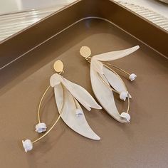 ✦Elevate your casual wear with the timeless elegance of our drop earrings, featuring a delicate flower petal design. Crafted with meticulous attention to detail, these earrings capture the essence of sophistication and grace. The drop silhouette adds a touch of movement, enhancing the overall allure of these elegant earrings. Versatile enough for everyday wear, they effortlessly complement your casual attire with a touch of floral charm. Embrace the understated beauty of our flower petal drop ea White Flower Earring, Basic Jewelry, Earring For Women, Stud Jewelry, Flower Petal, Elegant Flowers, Sterling Silver Flowers, Dangly Earrings, Delicate Flower