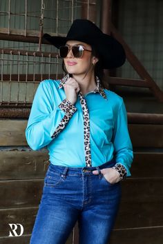 LEOPARD AND TURQ PERFORMANCE RODEO SHIRT (ADULT) – Ranch Dress'n Blue Western Tops For Fall, Blue Western Style Tops For Fall, Fitted Turquoise Long Sleeve Tops, Fitted Turquoise Tops For Fall, Fitted Turquoise Top For Fall, Fitted Tops For Rodeo In Fall, Fitted Blue Western Tops, Fitted Blue Shirt For Fall, Blue Western Tops For Rodeo