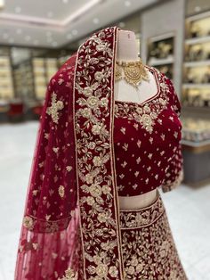 Elegant and luxurious, our Maroon Bridal Lehenga BL-147 is perfect for your special day. Made from soft velvet and adorned with intricate gold work, this lehenga exudes opulence and sophistication. Make a statement and feel like royalty with this stunning piece. Fabric: Velvet! WASH CARE INSTRUCTIONS - Please Dry clean only when it is applicable! Ready to Ship! Traditional Velvet Sharara For Diwali, Velvet Traditional Wear With Pallu For Festivals, Traditional Velvet Wear With Dori Work, Velvet Traditional Wear With Dori Work For Festivals, Elegant Gold Velvet Traditional Wear, Festive Velvet Lehenga With Pallu, Bollywood Velvet Sets With Pallu, Diwali Velvet Lehenga With Pallu, Velvet Lehenga With Pallu For Diwali