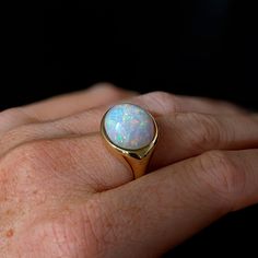 This beautiful ring features a 9.53 carat east west opal solitaire set in solid 14K gold. This Opal ring makes a beautiful October birthstone gift for your loved ones! This ring is made with solid 14K Gold and natural Earth mined SI / G-H diamonds. As listed, this ring is ready to ship. If you're interested in purchasing this setting with a different center stone please message us!