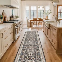 a long rug in the middle of a kitchen