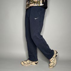 Vintage Nike Sweatpants Dark Navy Blue Cotton White Swoosh Baggy Wide Leg Y2K Skate / Streetwear Great Condition: 9/10 Men's Size: Small My Hands in Pockets = It has Pockets No Hands in Pockets = Does Not Have Pockets Drawstring Will be Visible in Forward Pic, if not Visible it Does Not Have a Drawstring About me: I am 6' 0" for reference I generally wear a Large (32" inseam) I Model XS to 2XL sweatpants, I find that you can often size up or down with 95% of sweatpants and they fit the same Vintage Nike Sweatpants, Nike Sweatpants Mens, Hands In Pockets, Wide Leg Joggers, White Joggers, Skate Streetwear, Nike Sweatpants, Nike Vintage, Y2k Nike