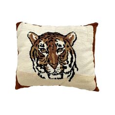 a pillow with a tiger embroidered on it