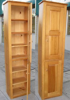 two wooden cupboards side by side on the sidewalk