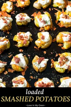 loaded smashed potatoes on a baking sheet with text overlay