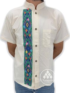 Typical Mexican shirt type Guayabera. Made by our artisans Chiapanecas by machine on multi-colored blanket. Although they follow the same pattern, the colors of the embroidery can vary from piece to piece. He is mao-necked and has a pocket. Mexican Artisan Design. Material: blanket (cotton). Sizes: Ch, M, G and EG. Primary color: multiple colors. Secondary color: multicolored embroidery. The availability of colors and sizes is limited. The photos are just a sample of those that are available. Pl Traditional White Shirt For Festivals, Traditional Short Sleeve Shirt With Multicolor Embroidery, Casual Cotton Shirt With Traditional Patterns, Traditional Fit Embroidered Shirt, Traditional Multicolor Cotton Shirt, Traditional Shirt With Multicolor Embroidery, Traditional Cotton Shirt With Motif, Traditional Green Cotton Shirt, Traditional White Embroidered Shirt