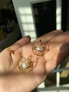 This pair of 3D orbit earring shows a  electron orbit with an artistic twist. + Nickle free gold plated brass + Earrings measure 1 inch in diameter + Come in gift ready package Check out another Orbital earrings design below: https://www.etsy.com/listing/1035554998/orbital-earringschemistry-giftelectron?ref=shop_home_active_2&frs=1 Perfect for gifting! 3d Earrings Jewelry, Internally Threaded Dangle Hoop Earrings As Gift, Gift Pearl Earrings With Metal Ear Wire, Single Pearl Earring As A Gift, Celestial Metal Earrings As Gift, Celestial Metal Earrings For Gift, Gold Orb Earrings For Gift, Internally Threaded Hoop Earrings As A Gift, Celestial Metal Hoop Earrings Gift