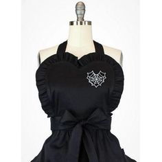 a black apron with a spider web on it