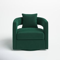 a green chair with two pillows on it