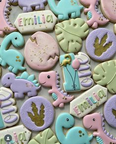 some cookies are decorated to look like animals and the words welcome baby on them, all in pastel colors