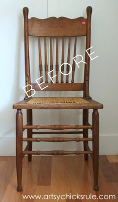 a wooden chair sitting on top of a hard wood floor next to a white wall