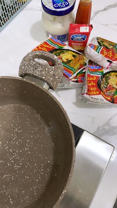 ingredients to make chinese stir fry sit on a counter top next to an aluminum skillet