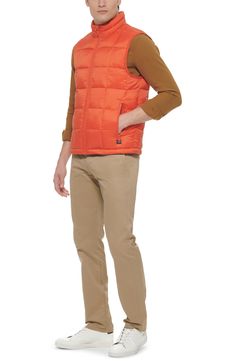 Windowpane stitching patterns turn this quilted puffer vest into a modern must-have accessory. Stand-up collar Sleeveless Front zip closure Dual front pockets Lined 100% recycled polyester Machine wash Imported Model stats: 6'1" height, 32" waist. Model is wearing size M Down Vest With Padded Collar, Casual Nylon Sleeveless Vest, Sleeveless Puffer Jacket For Fall, Sleeveless Down Vest With Padded Collar, Casual Sleeveless Nylon Vest, Casual Nylon Vest With Functional Pockets, Casual Nylon Vest With Padded Collar, Casual Fall Vest With Functional Pockets, Casual Cold Weather Vest With Pockets