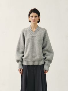 Editor's NotesMohan is a compound word that means MODERATION HANDLING - dealing with moderation. Mohan's basic philosophy is Maximize Minimal. It expresses the feminine neutral aspect in a calm and restrained design based on classical elements. We prioritize communication of various thoughts based on a broad spectrum of research rather than personal inspiration and intuition.- This is a cozy V-neck knit sweater made from a blend of alpaca and wool materials. - It provides a warm feeling, thanks to the use of long-fibered yarn, making it suitable for wearing even in the coldest winter months. - The thick yarn and oversized silhouette allow for comfortable wear. - This product is available in two sizes: S and M.Measurements(in.)Size: One size ( XS - M )- Shoulder:35.83/36.22  in.- Chest Knitwear Fashion Design, Modern Knitwear, Thick Yarn, Thick Sweaters, Knitwear Fashion, Sweater Making, Winter Knits, Sweater Fashion, Cotton Sweater