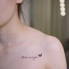 a woman with a small tattoo saying take me to you on her left side chest