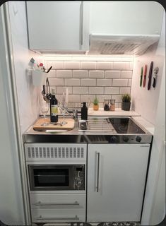 a kitchen with a stove and sink in it