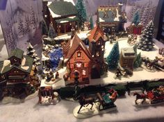 a christmas village with lots of houses and trees