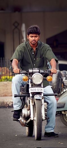 a man riding on the back of a motorcycle