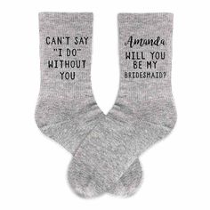 two pairs of socks that say, enjoy's right sock and left sock with black lettering