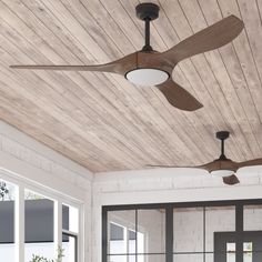 a ceiling fan mounted to the side of a wooden ceiling in a room with windows