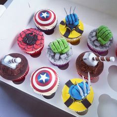 the cupcakes are decorated like superheros