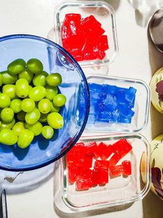 grapes and gummy bears are in plastic containers