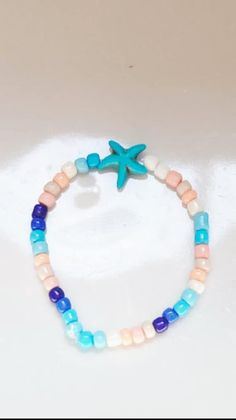 Express summer joy with this Summer Seed Bracelet! It's cute, stylish, and perfect for the warm season. Beaded Bracelets For Beach Season, Summer Beach Beaded Bracelets, Casual Beaded Bracelets For Summer Beach, Summer Beaded Bracelets For Beach, Casual Beaded Bracelets For Vacation And Summer, Casual Beaded Bracelets For Summer Vacation, Cute Adjustable Stretch Bracelet For Vacation, Adjustable Cute Stretch Bracelet For Vacation, Strand Bracelets For Summer Beach Party