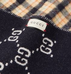 Gucci scarf decorated with classic checks on one side and the label's 'GG' motif on the other in a dark navy, so you can switch between the two depending on your outfit. Made in Italy, it's knitted from insulating wool and has fringed ends. 100% Wool Luxury Gucci Scarves For Fall, Gucci Luxury Winter Scarf, Gucci Luxury Winter Scarves, Luxury Gucci Winter Scarves, Luxury Gucci Scarves For Winter, Luxury Gucci Scarf For Winter, Gucci Designer Winter Scarves, Designer Gucci Winter Scarves, Designer Gucci Scarves For Winter