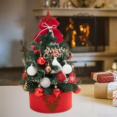 a small christmas tree sitting on top of a table