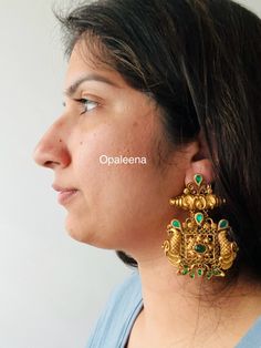 Exquisite gold jhumka earrings adorned with vibrant green stones - a stunning addition to your jewellery collection.  Length: 7.7 cms  Width: 5.6 cms  Weight: 51 cms Green Chandbali Bridal Earrings With Latkans, Green Kundan Drop Dangler Earrings, Green Kundan Drop Earrings, Green Kundan Earrings With Intricate Design, Green Kundan Drop Danglers, Green Chandbali Bridal Earrings With Intricate Design, Green Chandbali Danglers Temple Jewelry, Green Chandbali Danglers In Temple Jewelry Style, Festive Green Chandbalis Drop Earrings