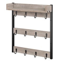 a wooden shelf with four hooks on it