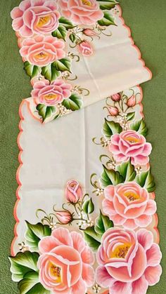 a table runner with pink flowers on it