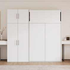 a white room with two desks and some cupboards on the wall next to each other