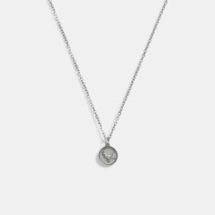 Part of our Men’s Jewelry Collection this long sterling silver chain necklace features a coin pedant detailed with Coach mascot Rexy. It’s finished with an easy clasp closure. | Coach Sterling Silver Coin Pendant Necklace Sterling Silver Medallion Necklace With Coin Pendant For Everyday, Everyday Sterling Silver Medallion Necklace With Coin Pendant, Silver Sterling Silver Coin Necklace With Delicate Chain, Silver Coin Necklace With Adjustable Chain For Everyday, Silver Minimalist Medallion Necklace With Adjustable Chain, Minimalist Silver Medallion Necklace With Adjustable Chain, White Gold Coin Necklace With Polished Finish, Everyday Silver Coach Jewelry, Sterling Silver Medallion Coin Necklace With Chain