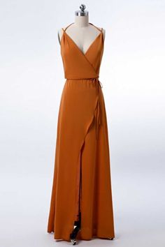 an orange dress on a mannequin dummy