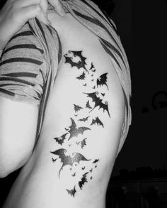 the back of a person's arm with bats on it