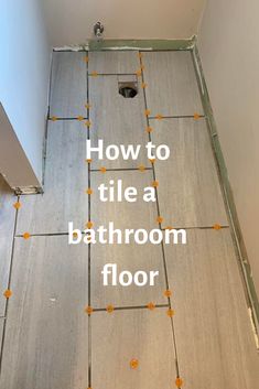 how to tile a bathroom floor with an orange dot pattern on the floor and in the shower