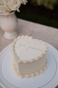 a heart shaped cake sitting on top of a white plate