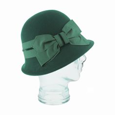 The Belfry Ardea is a classic 1920s cloche featuring a flattering asymmetrical brim and a velvet accented grosgrain ribbon band. Expertly crafted with vintage details, this hat is the perfect addition to any outfit! Its unique design adds a touch of elegance and sophistication whether you opt for the brilliant accent of green or keep it sleek with its timeless black option, making it a must-have for any fashion-forward individual. FEATURESStyle: ClocheMaterial: 100% WoolBand: 2" Grosgrain Ribbon Classic Spring Cloche Hat, Classic Hat With Ribbon And Short Brim, Classic Brimmed Hat With Bow, Retro Spring Cloche Hat, Classic Spring Hat With Bow, Classic Short Brim Hat With Bow, Classic Adjustable Hat With Bow, Fitted Brimmed Hat With Bow, Elegant Solid Color Cloche Hat For Spring