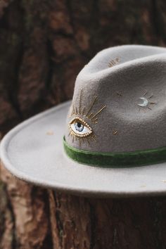 🔥 Elevate Your Adventure Style with this One-of-a-Kind Handmade Felt Fedora! 🔥 🌟 Key Features:    * Hand-embroidered details for a touch of exclusivity.    * Unisex design, embracing the spirit of wanderlust and self-expression.    * Made from high-quality wool, ensuring durability and comfort.     * No replicas! Your fedora is as unique as your adventurous spirit. 🎩 Witchy Vibes & Wild Spirit: This isn't just a fedora; it's a symbol of distinctiveness. Crafted as a one-of-a-kind piece, mirr Handmade Hats For Fall Gifts, Custom Handmade Felt Hat For Fall, Handmade Custom Felt Hat For Fall, Handmade Fedora With Short Brim As Gift, Whimsical Handmade Hat Bands For Festivals, Handmade Artisan Fedora For Winter, Handmade Short Brim Fedora As Gift, Handmade Costume Hats With Curved Brim For Gifts, Whimsical Fedora Hat As Gift