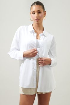 Clean classics. This seasonless button down shirt is perfect for layering throughout the year. No need to steal your boyfriend's shirts anymore. Features a classic collar with functional buttons along the center front. Maintains an oversized fit with a slight drop shoulder and elongated hem. Layer it over a ribbed tank and denim cutoffs.- Functional buttons- Button cuffs- Oversized- Drop shoulder- Color: WhiteSize + Fit - Model is 5'9" and wearing size XS- Measurements taken from size S - Chest: Camisole Bra, Oversized Button Down Shirt, Garment Cover, Wrap Jumpsuit, Kimono Sweater, Bra Dress, Denim Cutoffs, Boyfriend Shirt, Body Dress