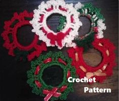 four crochet christmas wreaths on a table with the words crochet pattern below them