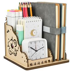 a wooden desk organizer with a clock, books and pencils in it's holder