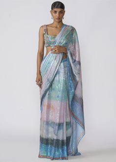 Kinfolk aurora printed sequin tulle draped saree with applique embellished blouse. Festive Embellished Pre-draped Saree, Designer Pre-draped Saree With Digital Print, Fitted Draped Sequin Blouse Piece, Fitted Draped Blouse Piece With Sequins, Fitted Pre-draped Saree With Sequins, Sequin Pre-draped Fitted Saree, Designer Wear Fitted Pre-draped Saree, Designer Fitted Pre-draped Saree For Designer Wear, Festive Multicolor Pre-draped Saree With Sequins