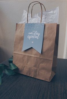 a brown paper bag sitting on top of a wooden table