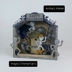 a halloween card with skeletons and a house