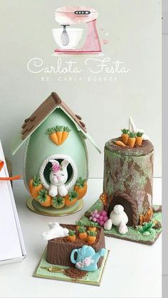 the cake is made to look like it has carrots on top and an egg in the shape of a house