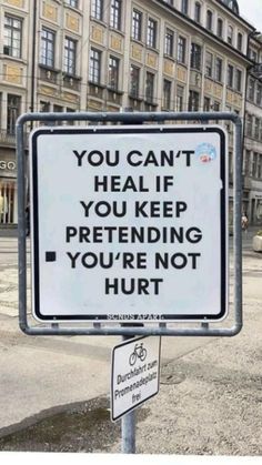 a sign that says you can't heal if you keep pretending you're not hurt