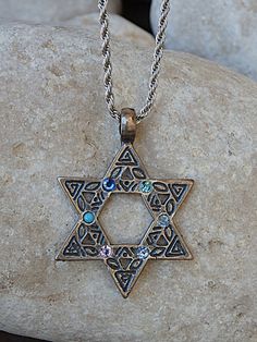 Star Of David Necklace, Blue Necklace, Jewish Jewelry, Magen David Pendant, Judaica Charms, Star Necklace, Mens Gift, For Him Magen david pendant with stones around it. Metal:silver plated Gemstone: crystals SIZE: Magen David: 3/3 cm ( 1.2\1.2 inches) Chain Length: 40 cm long (16 inches) . If you need a different size please write in note. The necklace will be packed in a gift box. FOR MY NECKLACES COLLECTION HERE: https://www.etsy.com/il-en/shop/rebekajewelry?section_id=14211169&ref=shopsec Jewish Magic, Necklaces Collection, Necklace Mens, Necklace Blue, Blue Necklace