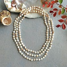 "Long or multi strand beaded hand knotted long endless infinity MOP necklace. -60\" length -8MM beads -Beautiful white mother of pearls https://www.etsy.com/shop/MYGEMSROCK" White Single Strand Mother Of Pearl Beaded Necklaces, White Single Strand Mother Of Pearl Beaded Necklace, White Pearl Long Necklace With Gemstone Beads, Adjustable Hand-strung White Pearl Necklace, White Multi-strand Hand-strung Jewelry, Hand-strung White Multi-strand Necklace, White Single Strand Necklace With Round Beads, White Mother Of Pearl Necklace With Gemstone Beads, White Hand Knotted Jewelry With Round Beads